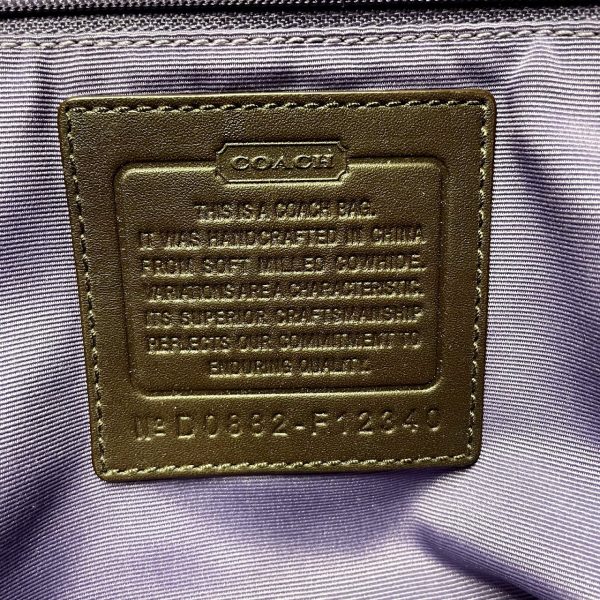 Close-up of authentic COACH handbag stitching